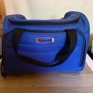 Delsey soft sided carry-on bag with detachable shoulder strap, royal blue